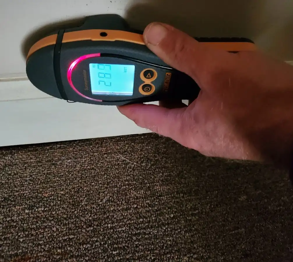Moisture detection at baseboard during Storm Damage Restoration in North Reading